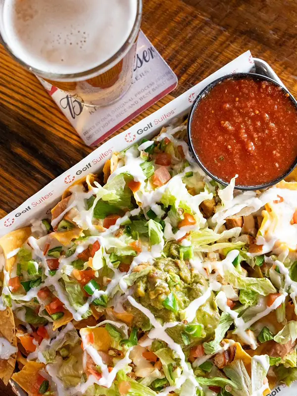 Come grab a beer and tasty nachos at Golfsuites Baton Rouge